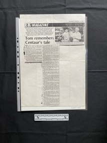 A large photocopy of a magazine article with a small black and white photo in the top right corner, of a woman and an older man holding an object, and two columns of text