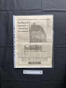 A large newspaper page showing two relevant stories.  The stories consist titles, six columns of text and two black and white photos.