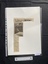 A small newspaper clipping of a title, black and white photo and a column of text
