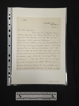 Two-page handwritten letter on cream paper with a black printed letterhead. 