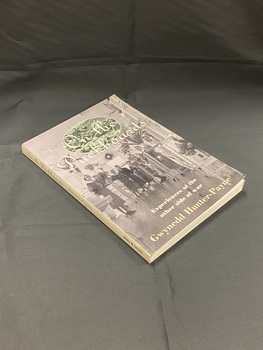 Paperback book with white spine showing title and author. The front cover displays a black and white image of nurses and patients standing in a hospital ward. At the top of the page behind the title is another image in an oval template of soldiers resting on the ground.