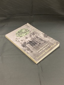 Paperback book with white spine showing title and author. The front cover displays a black and white image of nurses and patients standing in a hospital ward. At the top of the page behind the title is another image in an oval template of soldiers resting on the ground.