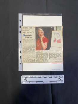 A small newspaper clipping consisting of a title, three columns of text and a colour photo.