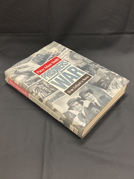 Dust-jacket covered in black and white photographic wartime images set out as a collage across the entire cover and spine. Rectangle template in the centre of the cover with author's name on a red background, followed by the title in large grey lettering, with the subtitle below on a black background. A similar text box is displayed on the spine.  
