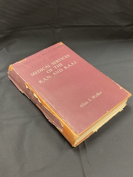 Dark red cloth bound hardcover book with a dark red torn dust jacket. 