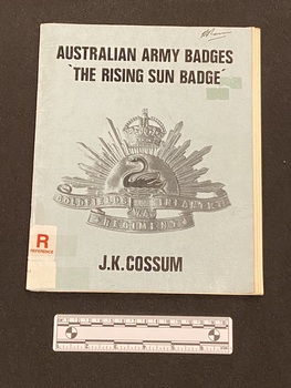 Staple bound booklet with light blue cover and black text. There is an image of the Rising Sun badge in the centre.
