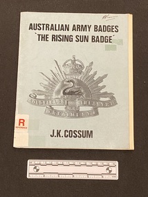 Staple bound booklet with light blue cover and black text. There is an image of the Rising Sun badge in the centre.