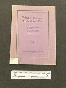 Staple bound paperback booklet with faded dark purple cover. White spine label wrapped around base of spine. Front cover has a black double border and black writing.