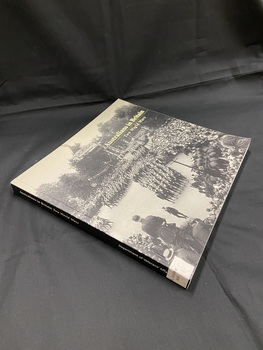 Paperback book with black spine and white print. Front cover is a full page, black and white image, of the Victory March in London in 1919. The title is printed in the top right corner.