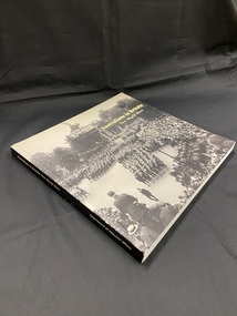 Paperback book with black spine and white print. Front cover is a full page, black and white image, of the Victory March in London in 1919. The title is printed in the top right corner. There is a white spine label sticker at the base of the spine.