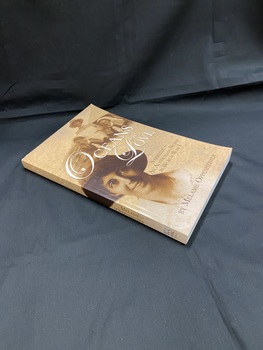 Sepia toned cover with two images on the front (a portrait of a woman, and three nursing sisters) and an image of a woman in profile on the back. The title is printed across the front and spine in white print, sub-title and author in brown.