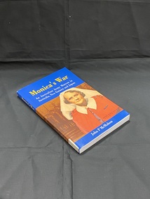 Royal blue paperback book with an image that wraps around the spine, of a matron in red uniform and white veil, in the background is a brown image of women in uniform in a line. The title is printed in yellow. The author and subtitle printed in white.