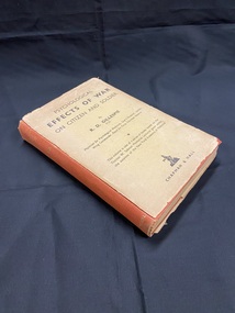 Faded red cloth-bound book with an extremely worn and torn dust-jacket that has its spine missing. Title printed in gold on the cloth-bound spine. What's left of the dust-jacket is faded light brown with black print.