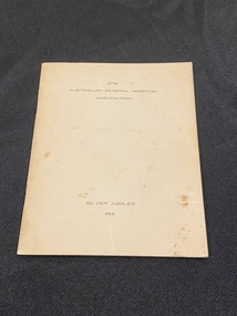 Staple bound booklet with thin, cream coloured, card cover. Title printed in black type across the top and bottom of the front cover.