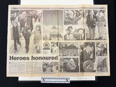 Two page black and white newspaper spread with twelve photographs of people in small and large groups and a statue.  Some people are in uniforms with medals, others are waving flags.  All photographs have captions and there is a brief four column article.