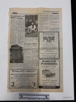 Full half newspaper spread with multiple stories in black text, three advertisements and two black and white photographs.