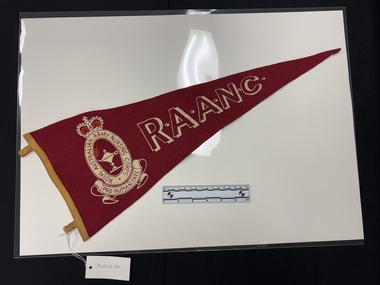 A red felted pennant flag with yellow edge and loops.  Logo and text printed on in white and pale red