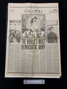 Large format pages cut from newspaper.  Front page has large headlines with images of soldiers and medals and eight columns of text, all in black and white.