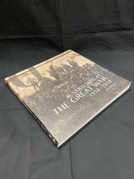 Paperback book. Black and white image of soldiers in uniform standing in front of and on top of a tank, wraps around the full cover. Title is overlaid in white print on the front and on the spine.