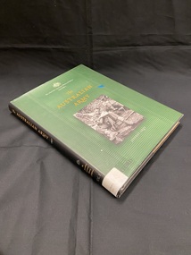 Black hard-cover book with green dust-jacket cover and black spine. Title printed in gold print down spine and spine label attached at the base. Front cover shows a photographic image of two soldiers sitting in the jungle. Above the image the series information is printed in white beneath the Australian emblem, beneath that the title is printed in gold.