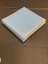 Blue post-bound album with triple gold lined border around the front cover and tiny gold square dots spaced out within the border. Hand-written in gold ink across the front is 'media album 2000'. There is gold writing down the spine.