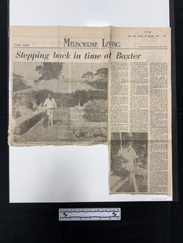 Large newspaper clipping with two black and white photographs and three columns of text.