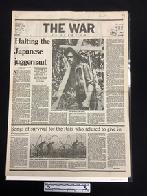 A large black and white newspaper lift-out with the cover showing the numerals 1939 filled with photos collaged together, several large headlines and subtitles, one article with two columns and a large captioned photo of a man in uniform with a gun on his shoulder, cigarette in his mouth, wearing a hat.