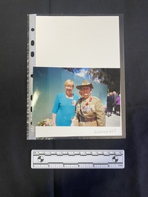 Colour photograph of an older woman in military uniform next to a woman in civies with military medals