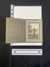A small black and white photo inside a card.