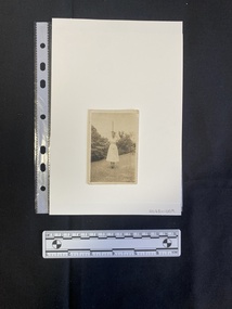A small black and white photo of a young woman in nurse's uniform.
