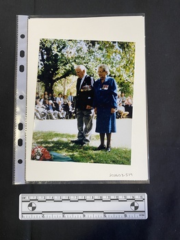 Colour photograph of an older couple wearing military medals