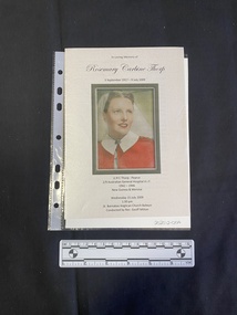 Folded A5 booklet printed on pale paper, consisting of photos and text . This booklet is a colour print.  Text outlines the order of service.