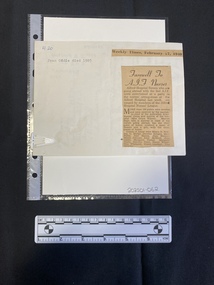 A handwritten letter with a newspaper clipping attached