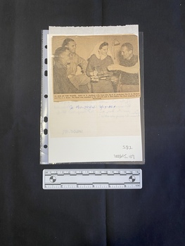 A hand written letter with a newspaper clipping glued to the reverse