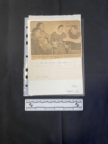 A hand written letter with a newspaper clipping glued to the reverse