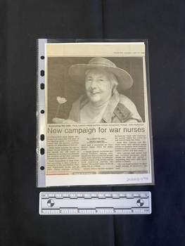A newspaper clipping consisting of a title, three columns of text and a large black and white photo