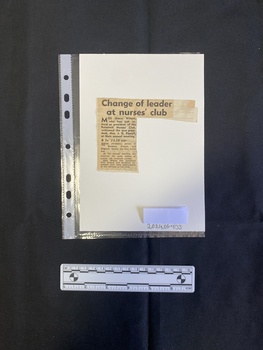 A small newspaper clipping consisting of a title and a single column of text. The clipping is glued onto a another piece of paper.