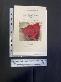 Folded A5 booklet printed on pale paper, consisting of photos and text . This booklet is a colour print.  Text outlines the order of service.