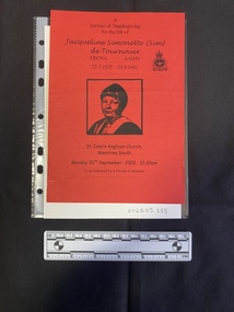 Folded A5 booklet printed on red paper, consisting of a photo and text. This booklet is a photocopy.  Text outlines the order of service.