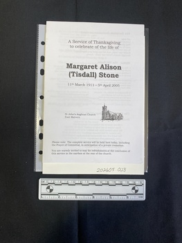 Folded A5 booklet printed on white paper, consisting of a picture and text. This booklet is a photocopy.  Text outlines the order of service.