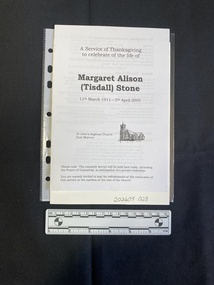 Folded A5 booklet printed on white paper, consisting of a picture and text. This booklet is a photocopy.  Text outlines the order of service.
