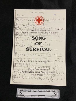 Staple-bound booklet on white paper. The cover is covered in sheet music and the title and event details are printed over the top in black ink. There is the red symbol of the Australian Red Cross Society printed at the top of the front cover.