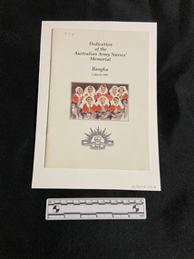Staple-bound booklet with white cover. Title is printed in black ink in the top centre. The bottom centre displays the emblem of the Australian Commonwealth Military Force. In the middle is a coloured painting of eight nurses wearing the red capes and white veils.