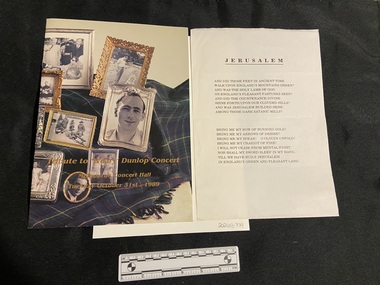 Staple-bound booklet. Cover is covered (both front and back), with a coloured image of a green woollen rug covered in ornate framed picture frames. The frames contain photographs from the private collection of Sir Edward Weary Dunlop. Across the image at the bottom of the front cover, the title and date is printed in gold text.