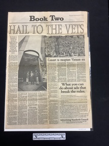 Large full page newspaper clipping with text in eight columns and two large black and white photographs, one of people watching a female performer on stage, the other of three people (two men and a woman) standing inside an architectural feature.