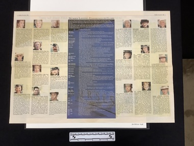 Centre newspaper spread with twenty colour headshot captioned photographs and a large central box with text as a chronology and blue background.  Spread has a red border at the top of the page underneath publication information.
