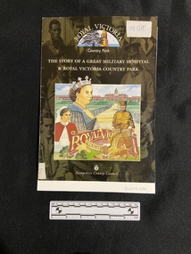 Staple bound glossy magazine. Cover displays a background of a dark black and grey photo of soldiers, over which is printed the title in cream print. Above the title, at the top of the page is the name and illustrated image of Royal Victoria Country Park. In the centre is a large square template containing a collage of illustrations of the Queen, a nurse, a wounded soldier and another soldier, a long drive leading up to a grand building.