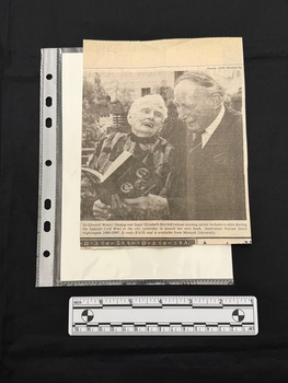 A newspaper clipping consisting of a black and white photograph of Sir Edward 'Weary' Dunlop and Sister Elizabeth Burchill.  