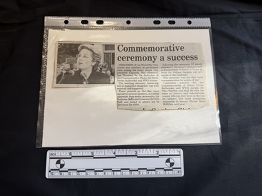 Two columns of print, titled 'Commemorative ceremony a success'.  A photograph of Ita Buttrose in front of two microphones sits to the left of the print.