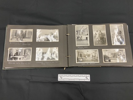 Inside page layout showing black and white photos glued on to black card pages and bound through two holes with elastic.
